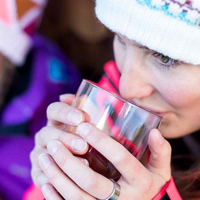 Woman drinks tea at the hotel with half board in Italy